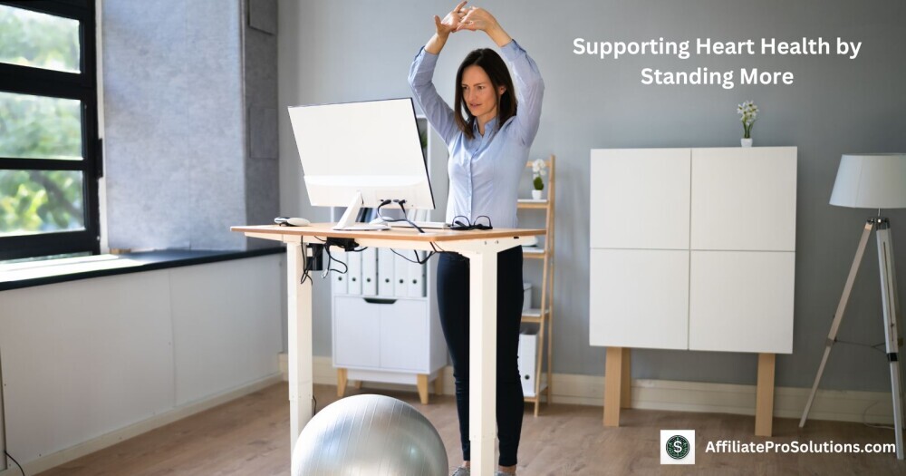 Supporting Heart Health by Standing More Photograph of a person using her standing desk workstation and stretching aiming to show the heart health benefits of using a standing desk.